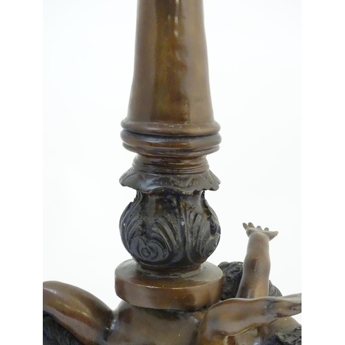 1223 - A 20thC bronze lamp with 5 glass globe shades. , the central column supported by putti. the whole ap... 