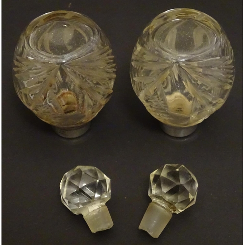 151 - A pair cut glass scene / perfume bottles with silver collars . Hallmarked London 1911 maker Hart & s... 