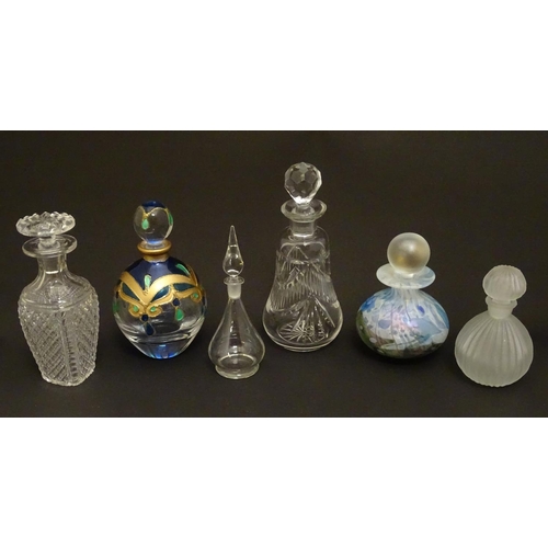 153 - 6 assorted glass / scent bottles The tallest 6