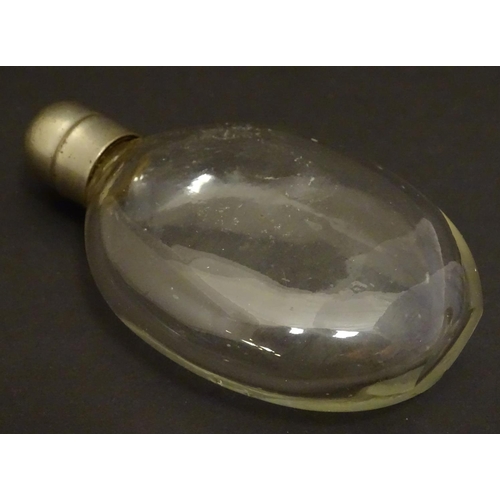 159 - A small glass hip flask of Ovid form with screw top. Approx. 4