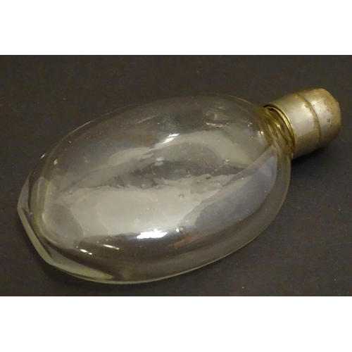 159 - A small glass hip flask of Ovid form with screw top. Approx. 4