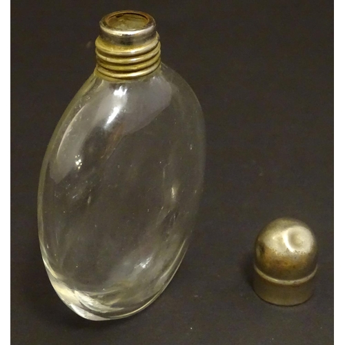 159 - A small glass hip flask of Ovid form with screw top. Approx. 4