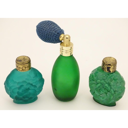 162 - A green glass scent / perfume bottle with atomiser top  together with two scent / snuff bottle with ... 