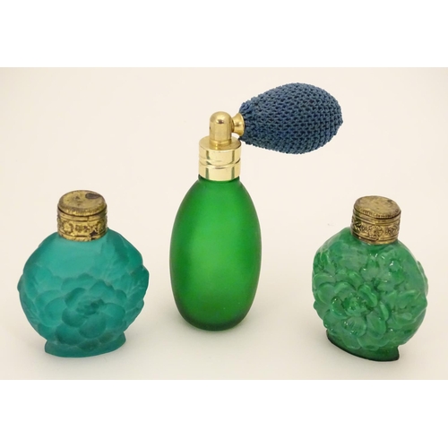 162 - A green glass scent / perfume bottle with atomiser top  together with two scent / snuff bottle with ... 