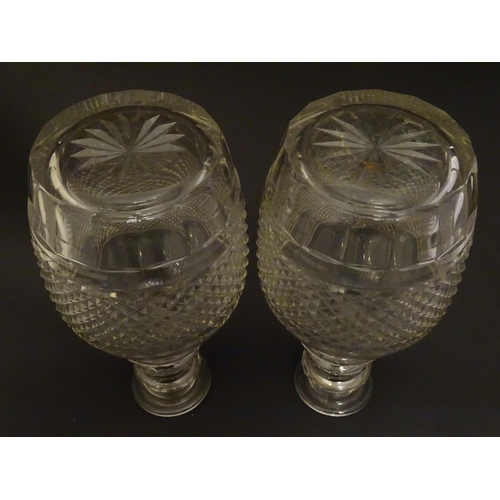 165 - A pair of three ring cut glass decanter with hobnail banding. Approx 11 1/4