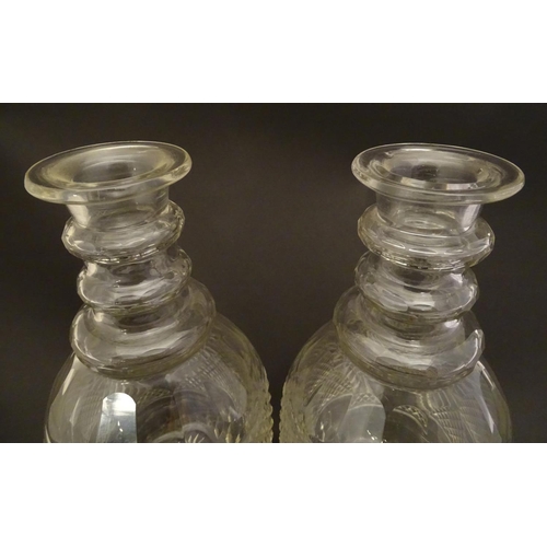 165 - A pair of three ring cut glass decanter with hobnail banding. Approx 11 1/4