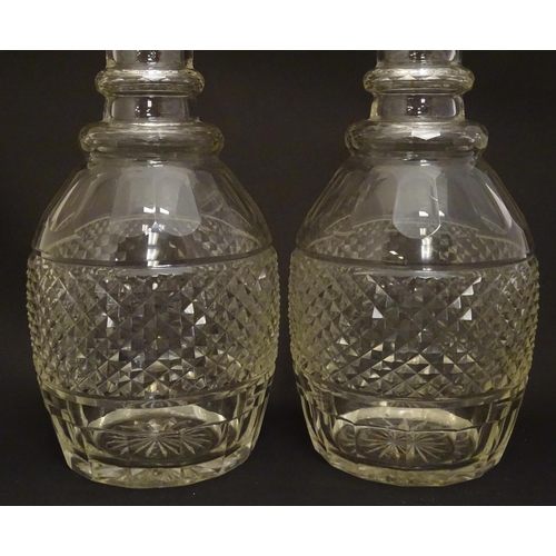 165 - A pair of three ring cut glass decanter with hobnail banding. Approx 11 1/4