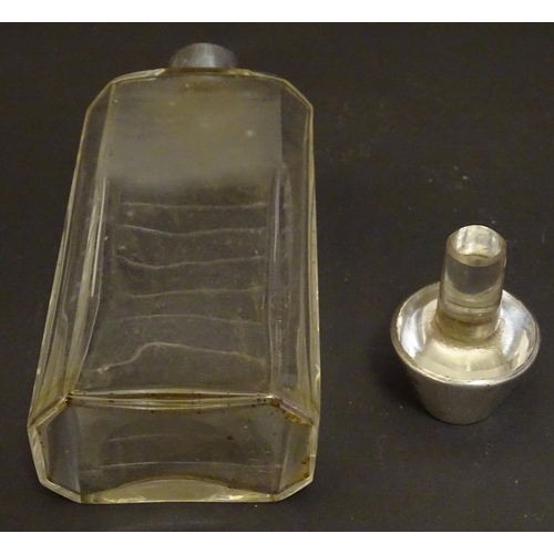 178 - A glass medicine flask / decanter with cut horizontal measure marks to back. With silver mount and s... 