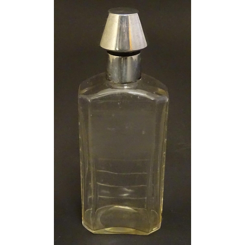 178 - A glass medicine flask / decanter with cut horizontal measure marks to back. With silver mount and s... 