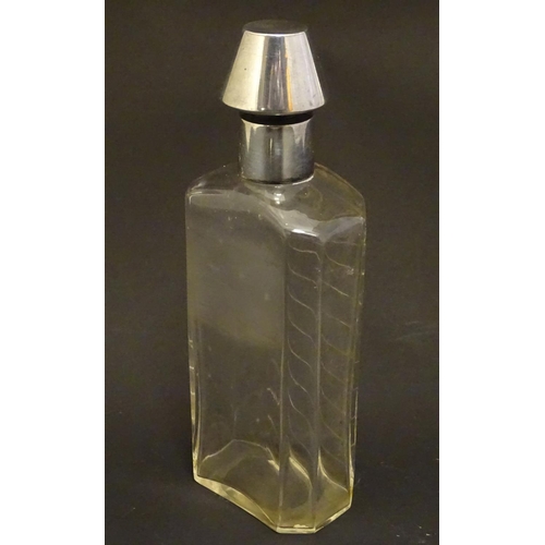 178 - A glass medicine flask / decanter with cut horizontal measure marks to back. With silver mount and s... 