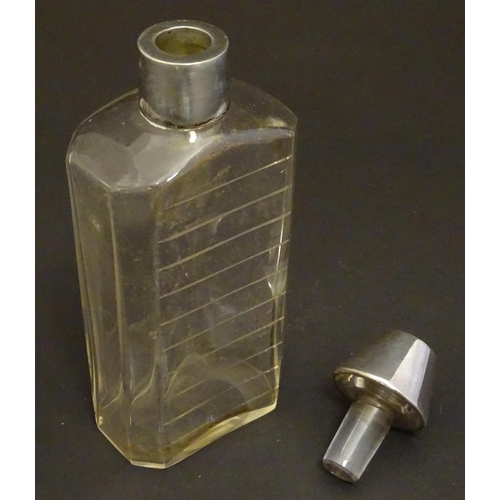 178 - A glass medicine flask / decanter with cut horizontal measure marks to back. With silver mount and s... 