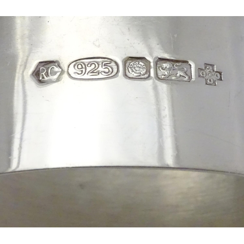 202 - A silver napkin ring of oval form. Hallmarked London 2000 maker Carr's of Sheffield Ltd.