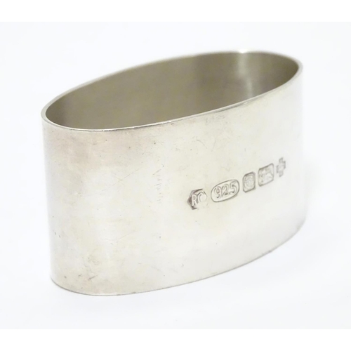 202 - A silver napkin ring of oval form. Hallmarked London 2000 maker Carr's of Sheffield Ltd.