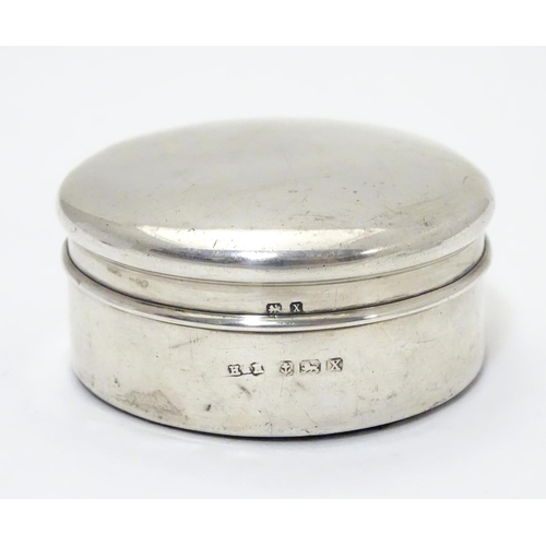 204 - A silver box of circular form. Hallmarked  Birmingham 1922 maker Harrison & Hipwood. 2