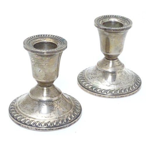 215 - A pair of sterling silver squat candlesticks with weighted bases. Marked Duchin Creation under. Appr... 