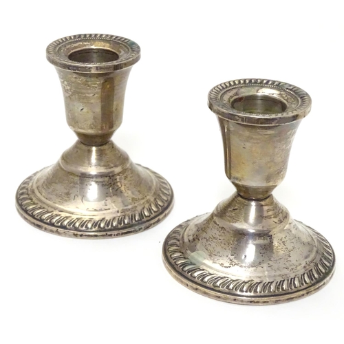 215 - A pair of sterling silver squat candlesticks with weighted bases. Marked Duchin Creation under. Appr... 