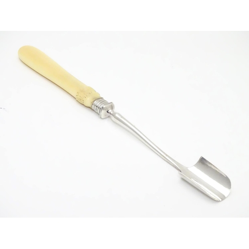 219 - A silver plated stilton / cheese scoop with silver ferule. 10