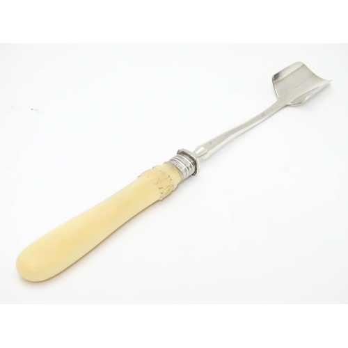 219 - A silver plated stilton / cheese scoop with silver ferule. 10