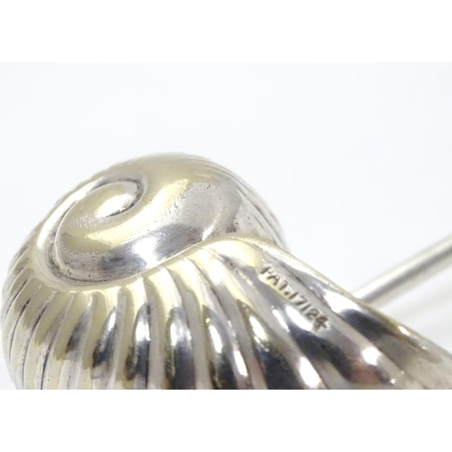 220 - An unusual silver plated sugar sifter spoon formed as a Nautilus shell, with patent stamp PAT 17124 ... 