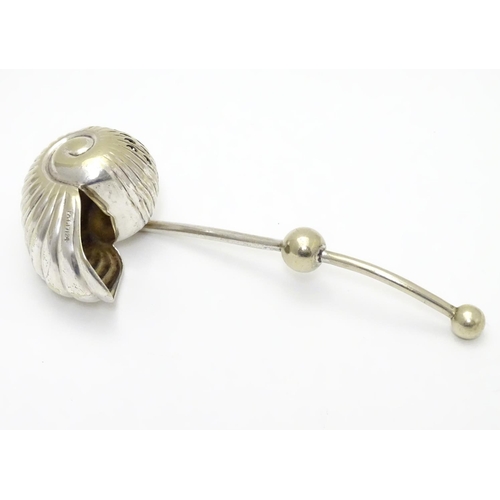 220 - An unusual silver plated sugar sifter spoon formed as a Nautilus shell, with patent stamp PAT 17124 ... 