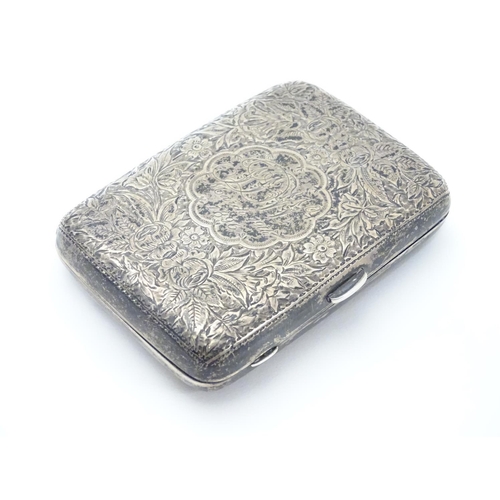 222 - A Victorian silver cigarette case with engraved floral and foliate decoration. Hallmarked Birmingham... 