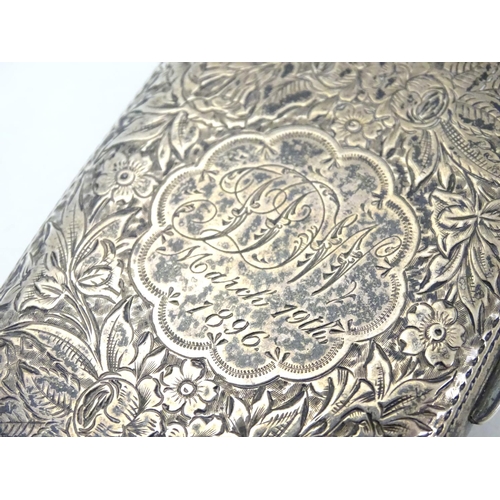 222 - A Victorian silver cigarette case with engraved floral and foliate decoration. Hallmarked Birmingham... 