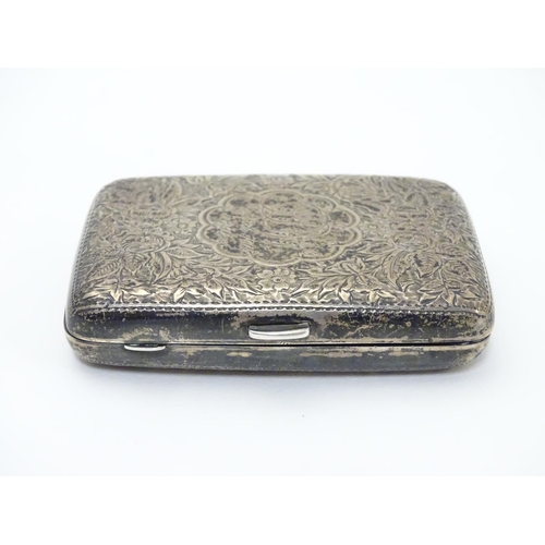 222 - A Victorian silver cigarette case with engraved floral and foliate decoration. Hallmarked Birmingham... 