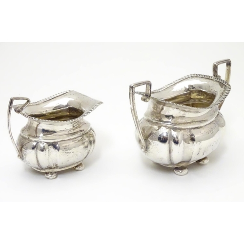 224 - A silver sugar bowl and milk jug hallmarked Chester 1904 maker George Nathan & Ridley Hayes (28g) (2... 