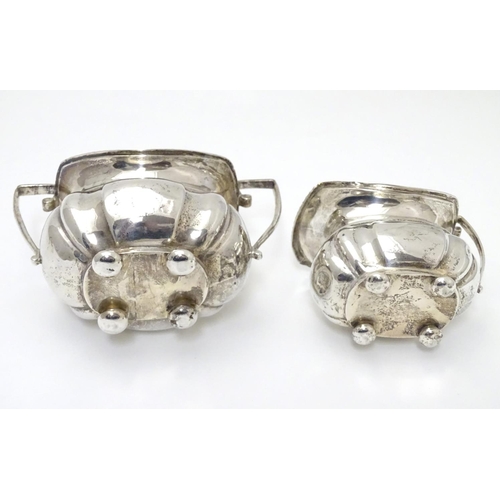 224 - A silver sugar bowl and milk jug hallmarked Chester 1904 maker George Nathan & Ridley Hayes (28g) (2... 