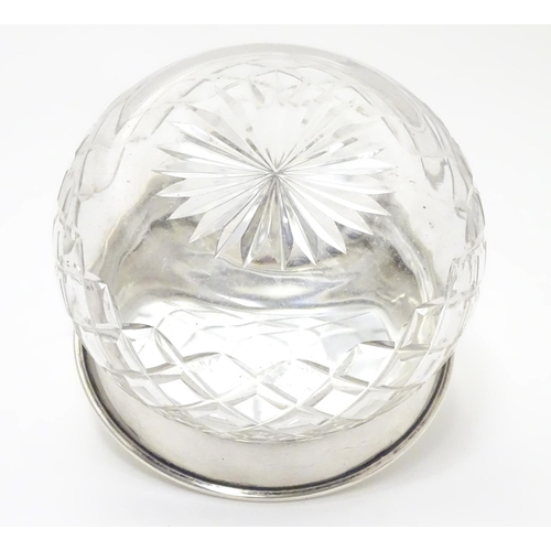 229 - A cut glass powder bowl with silver lid hallmarked Birmingham 1922 maker Charles S Green & Co Ltd. A... 