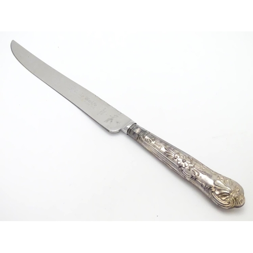 233 - A silver handled cake knife hallmarked Sheffield  1975. Harrison Brothers  10