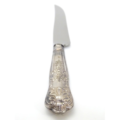 233 - A silver handled cake knife hallmarked Sheffield  1975. Harrison Brothers  10