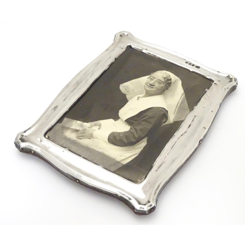 234 - A photograph frame with silver surround. Hallmarked Birmingham 1912 maker Jones & Crompton. 7