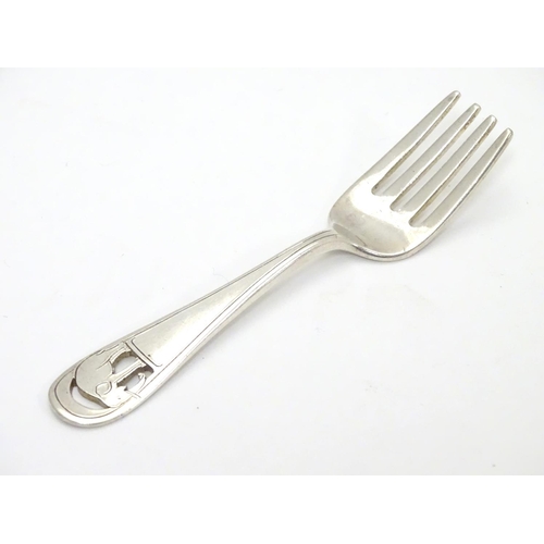 239 - An American Arts and Crafts sterling silver small fork. Having pierced and engraved design of an ele... 