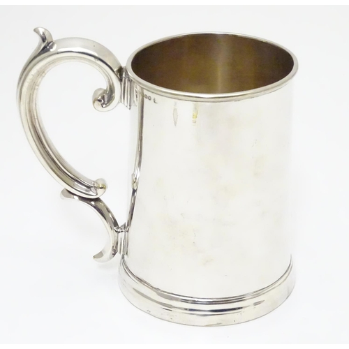 240 - A mid 19thC silver plated 1 pint tankard by Harrison of Sheffield. 5 1/2