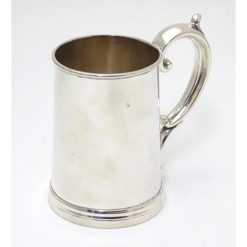 240 - A mid 19thC silver plated 1 pint tankard by Harrison of Sheffield. 5 1/2