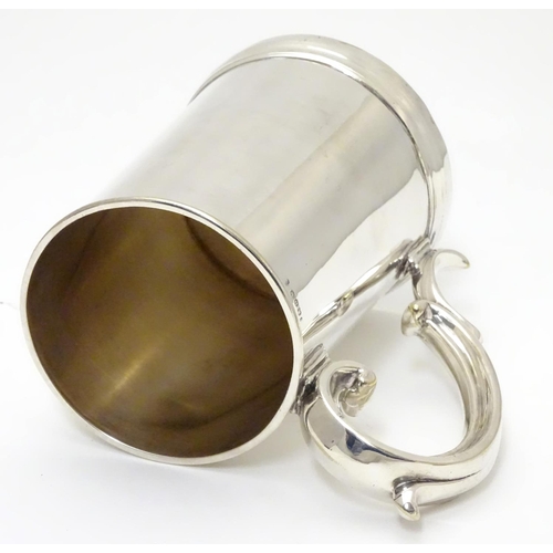 240 - A mid 19thC silver plated 1 pint tankard by Harrison of Sheffield. 5 1/2