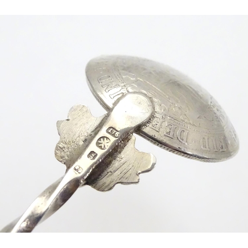 243 - A Maltese silver shallow ladle/ice cream spoon, the twisted handle terminated with a Maltese cross, ... 