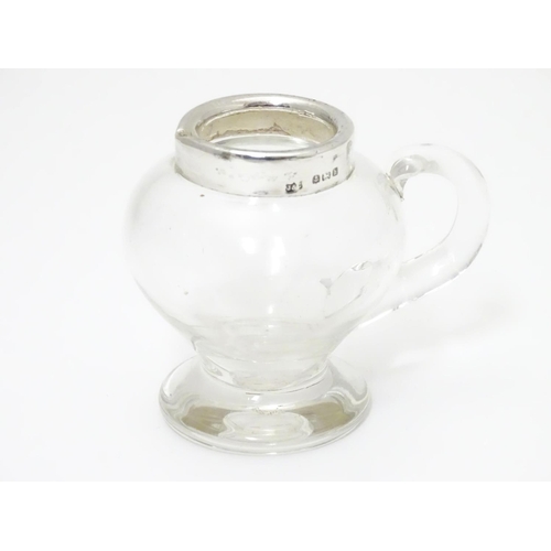 244 - A glass jug / noggin with silver mount hallmarked Birmingham 1907 maker Jones & Crompton 2 3/4