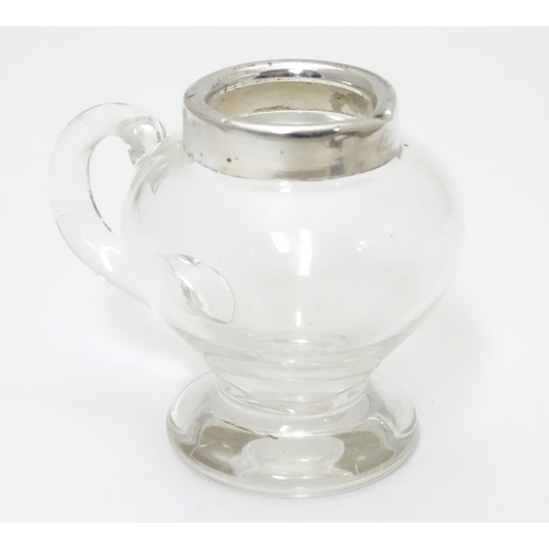 244 - A glass jug / noggin with silver mount hallmarked Birmingham 1907 maker Jones & Crompton 2 3/4