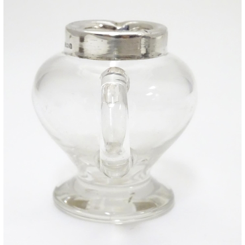 244 - A glass jug / noggin with silver mount hallmarked Birmingham 1907 maker Jones & Crompton 2 3/4