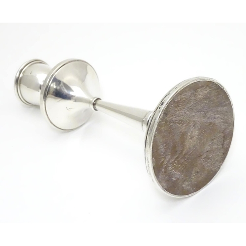 246 - A silver candlestick hallmarked 1918 maker Napper & Davenport and marked with reg des no. 655179. Ap... 