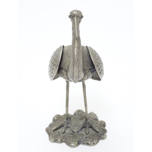 256 - A white metal model of a stork / crane. indistinctly marked under. Approx. 4 1/2