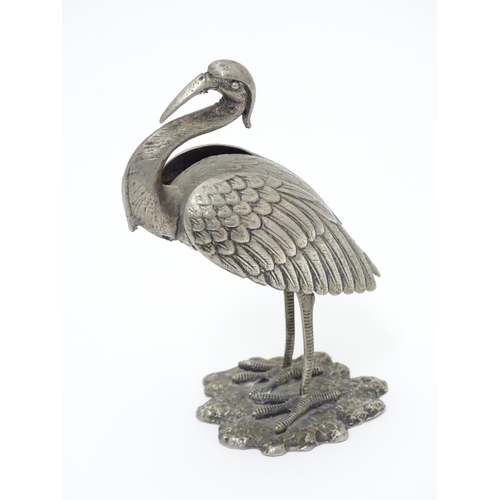 256 - A white metal model of a stork / crane. indistinctly marked under. Approx. 4 1/2