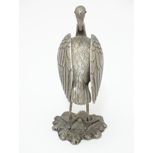 256 - A white metal model of a stork / crane. indistinctly marked under. Approx. 4 1/2