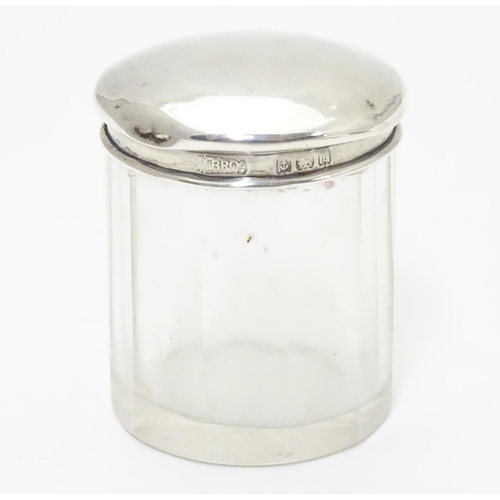 257 - A glass dressing table pot with silver top hallmarked Birmingham 1905 maker  M bros. 2