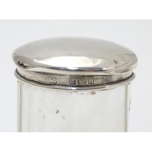 257 - A glass dressing table pot with silver top hallmarked Birmingham 1905 maker  M bros. 2