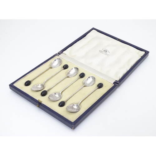 262 - A cased set of 6 silver coffee spoons with coffee bean decoration to handles. Hallmarked Birmingham ... 