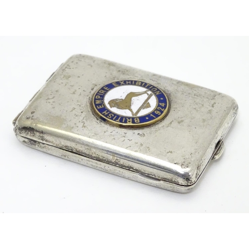 265 - A silver plate match book case with enamel roundel to top ' British Empire Exhibition 1924'  2 1/4