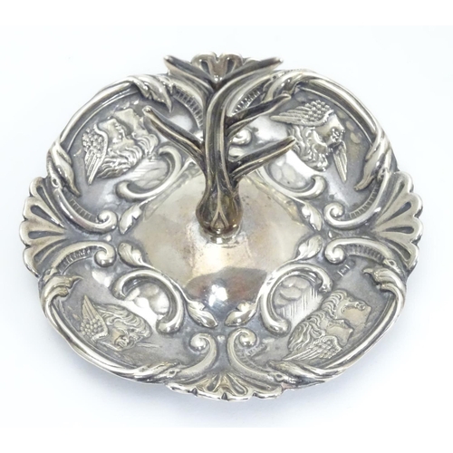 266 - A silver ring tree, the base with winged cherub decoration. Hallmarked Birmingham 1906 maker Henry M... 